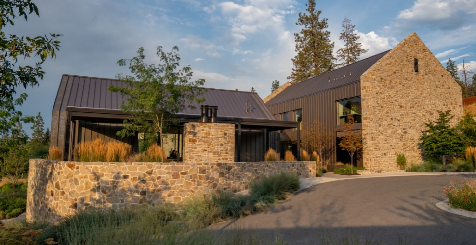 Sunset shining golden hour light on the Tasting Room and Aspect house at Cedar Creek Estate Winery