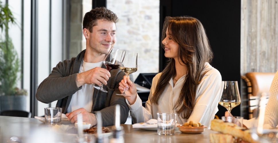 A couple enjoying an intimate dining experience at Home Block Restaurant