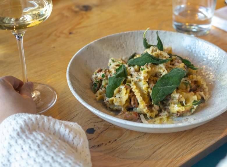 Home Block Restaurant homestyle mushroom and sausage campanelle pasta main course served with Platinum white wine