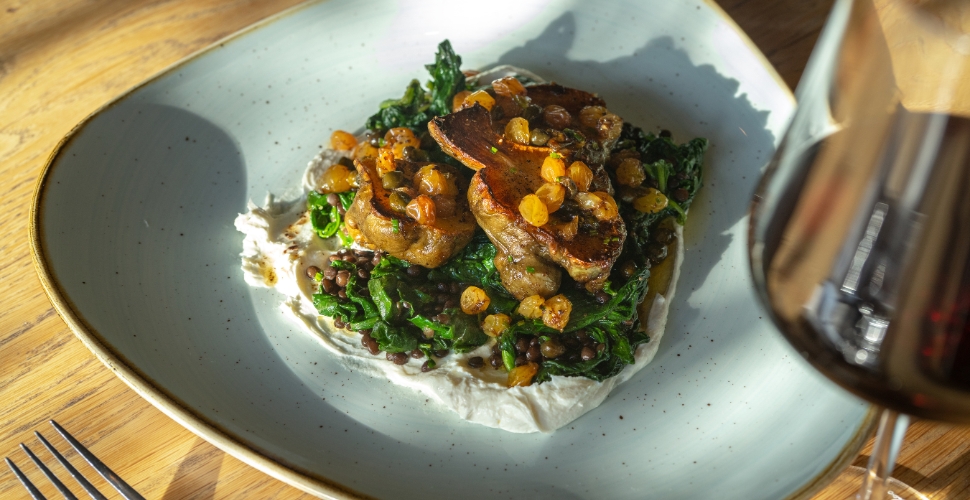 Home Block Restaurant's local braised greens served with Cedar Creek Estate Winery's Platinum Pinot Noir